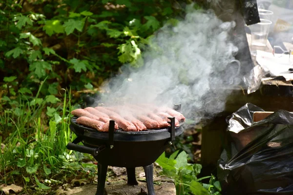 outdoor grilled sausages on a barbecue