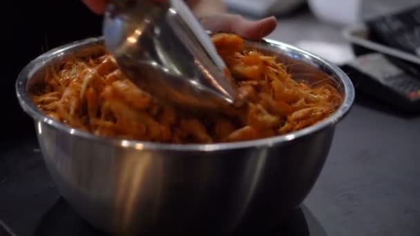 A Lot of Red Boiled Shrimps in a Big Bowl and Hands of Woman Shuffling Seafood. — Stock Video