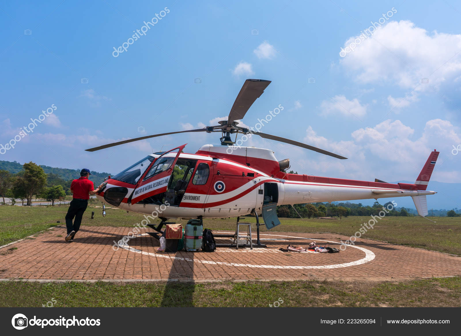 Red Helicopter on Helipad for helicopter landing surrounded with Red Helicopter on Helipad for helicopter landing surrounded with