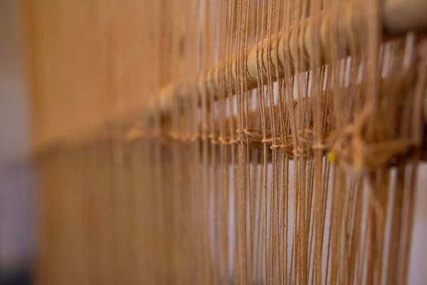 Old style tool for weaving a carpet with traditional techniques on a loom, in the privat family manufacture in Atlas mountains in Tinghir, Morocco — Stock Photo, Image