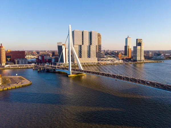 ROTTERDAM, NETHERLANDS: MARCH 2020: Aerial view on the Erasmus Bridge and downtown Rotterdam at evening sunset time — 图库照片