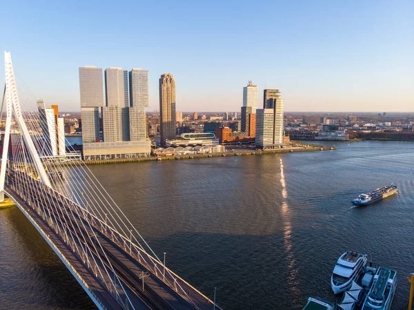 ROTTERDAM, NETHERLANDS: MARCH 2020: Aerial view on the Erasmus bridge and downtown Rotterdam at evening sunset time — Stock Photo, Image