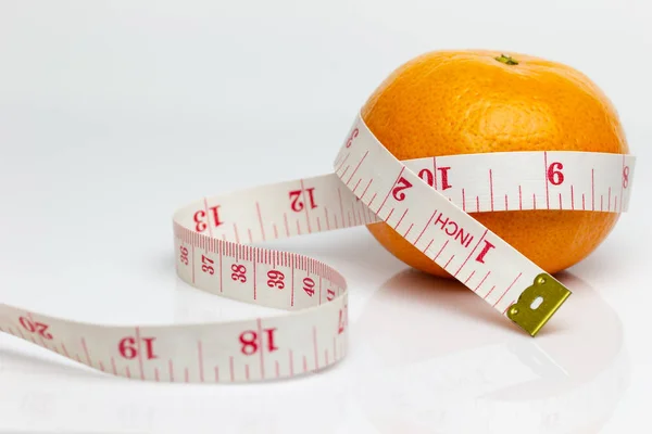 Closeup Tangerine Wrapped Measuring Tape Concept Love Health Care Diet Royalty Free Stock Images