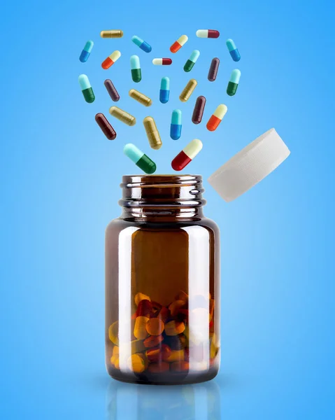 Medicine Bottle Opened Pill Floating Shape Heart Blue Background Concept — Stock Photo, Image