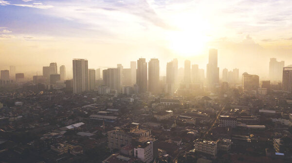 JAKARTA - Indonesia. May 21, 2018: Beautiful aerial sunset view of downtown Jakarta with residential houses and skyscraper