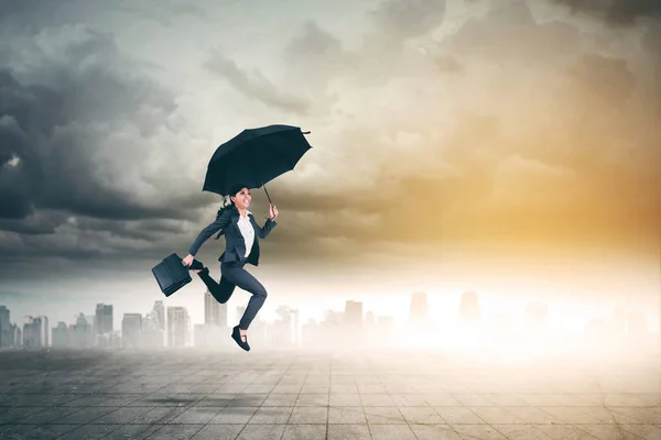 Asian Businesswoman Holds Suitcase Umbrella While Jumping Skyscraper Background — Stock Photo, Image