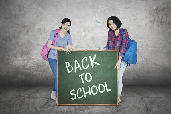 Image Two Female College Students Holding Chalkboard Text Back School — Stock Photo, Image