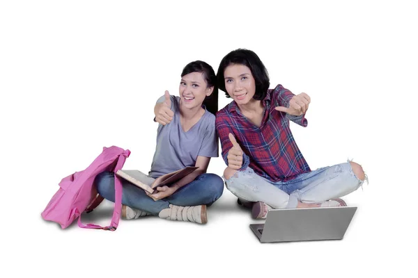 Two College Students Showing Thumbs While Sitting Together Studio Isolated — Stock Photo, Image