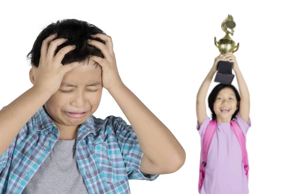 Picture Sad Preteen Boy Looks Enviously His Smart Sister While — Stock Photo, Image