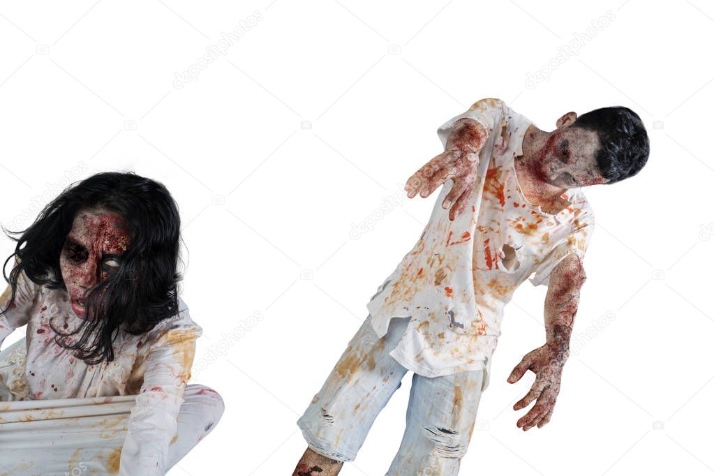 Halloween horror concept. Image of two scary zombies with wounded face, isolated on white background