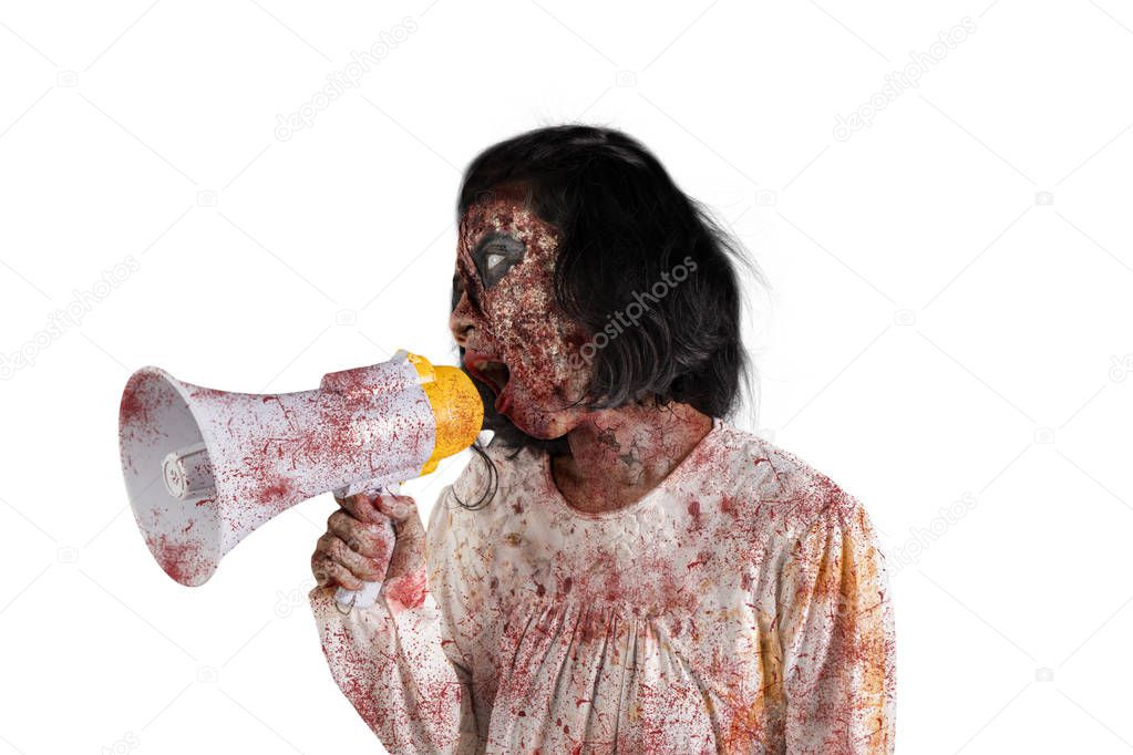 Halloween horror concept. Picture of creepy female ghost using a megaphone to speak, isolated on white background
