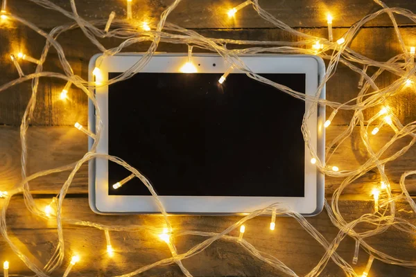 Top View Digital Tablet Christmas Lights Wooden Table — Stock Photo, Image