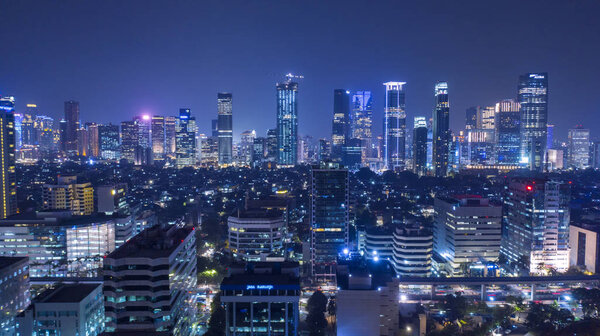 JAKARTA - Indonesia. October 12, 2018: Beautiful scenery of Jakarta city at night time with glowing light skyscrapers