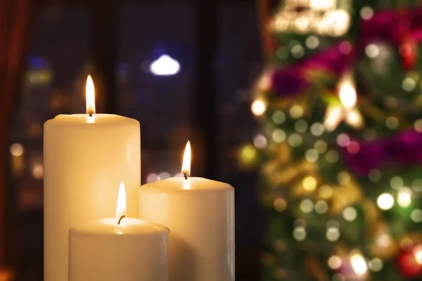 Close Three White Candles Blurred Christmas Tree Background Shot Home — Stock Photo, Image