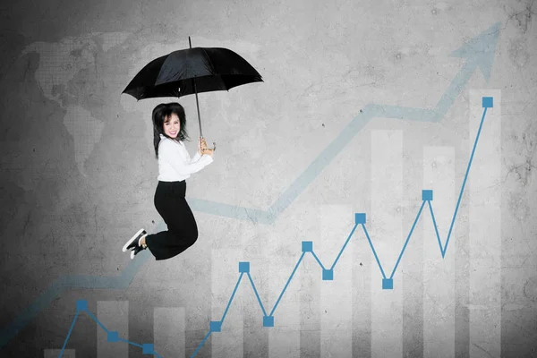 Picture Excited Businesswoman Jumping Growth Finance Graph While Holding Umbrella — Stock Photo, Image
