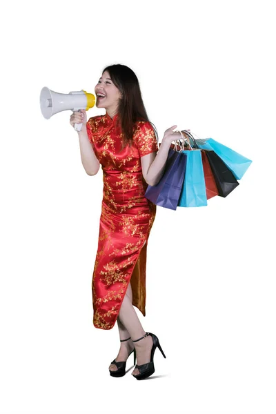 Beautiful Woman Speaking Megaphone While Holding Shopping Bags Studio Chinese — Stock Photo, Image