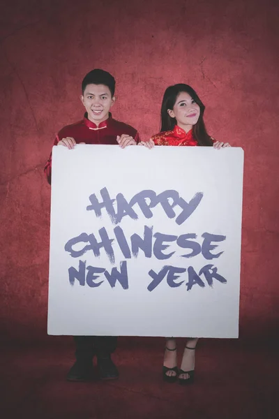 Portrait Young Couple Holding Whiteboard Text Happy Chinese New Year — Stock Photo, Image