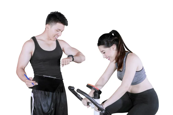 Picture Beautiful Woman Using Exercise Bike Her Trainer Studio Isolated — Stock Photo, Image