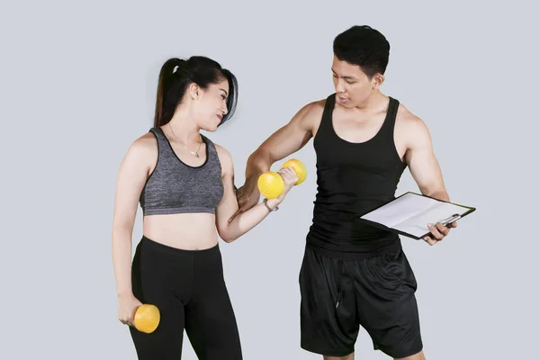 Picture Male Trainer Helping Young Woman Exercise Dumbbells Studio — Stock Photo, Image