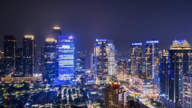 JAKARTA - Indonesia. December 12, 2018: Beautiful Jakarta downtown with glowing high buildings at night time clipart