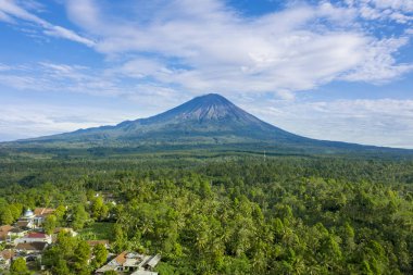 Aerial view of Semeru mountain with residential houses at morning time in East Java, Indonesia