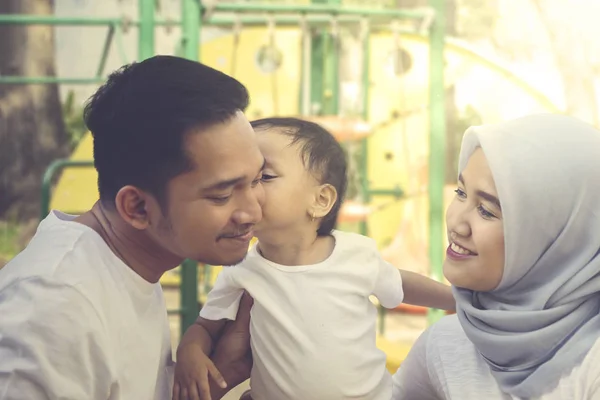 Image Baby Girl Kissing Her Parents While Playing Playground Shot — 图库照片