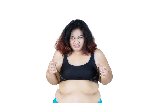 Image Obese Woman Looks Angry While Wearing Sportswear Studio Isolated — Stock Photo, Image