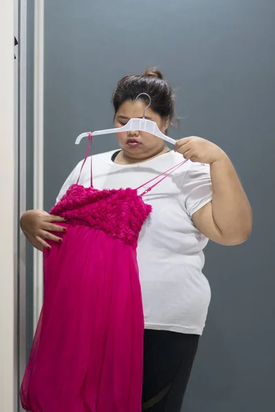 Portrait Fat Woman Looks Sad While Trying Her Old Red — Stock Photo, Image