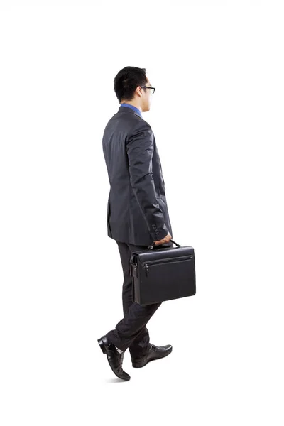 Rear View Male Entrepreneur Carrying Briefcase While Walking Studio Isolated — Stock Photo, Image