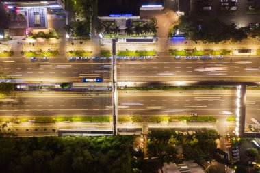 JAKARTA - Indonesia. February 15, 2019: Top view of beautiful highway with light trails of vehicle at night time in Jakarta, Indonesia clipart