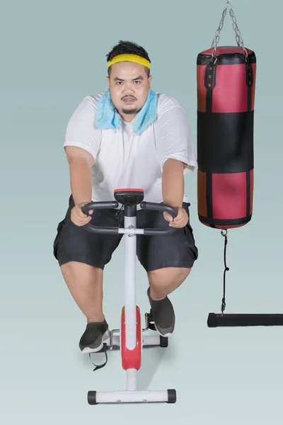 Overweight Man Wearing Sportswear While Using Exercise Bike Weight Loss — Stock Photo, Image