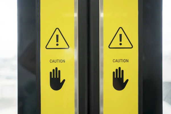 Caution sign on the Jakarta MRT door — Stock Photo, Image