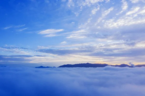 Misty morning above mountain at sunrise time — Stock Photo, Image