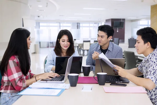 Young business people work together in the office — Stock Photo, Image