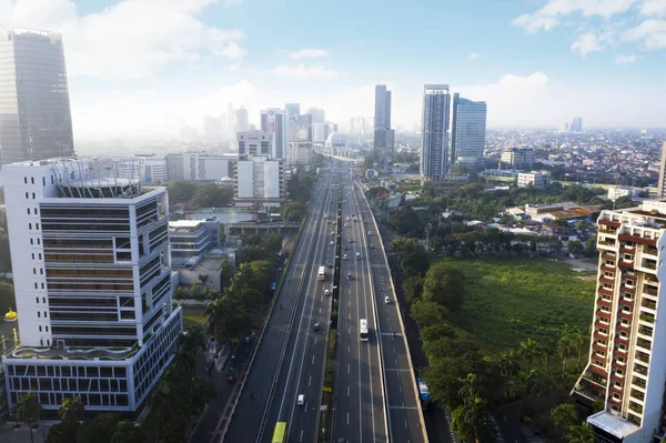 Jakarta cityscape with vehicles on highway — Stock Photo, Image