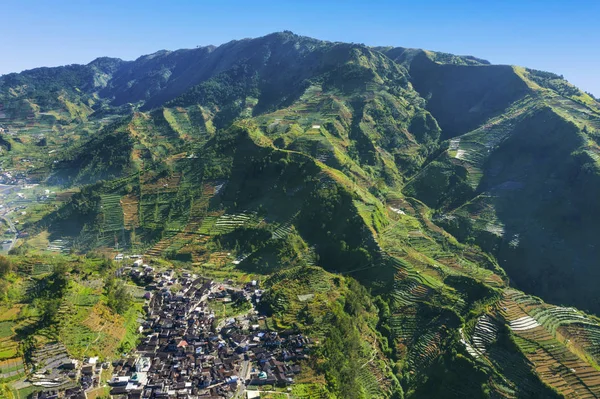 Beautiful Dieng Plateau with farmland and village