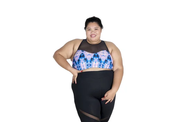 Confident fat woman wearing sportswear on studio — Stock Photo, Image