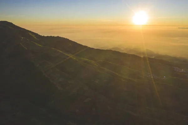 Dieng plateau with farmland at sunrise time — Stock Photo, Image