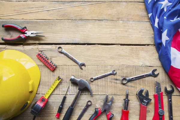 Handy tools and American flag on the wooden table — Stock Photo, Image