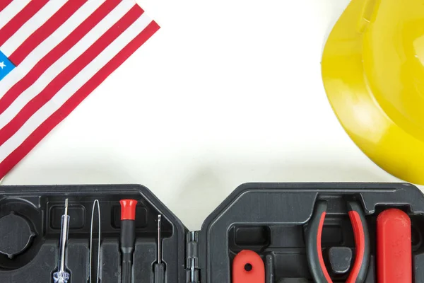 Toolbox with helmet and America flag on table — Stock Photo, Image