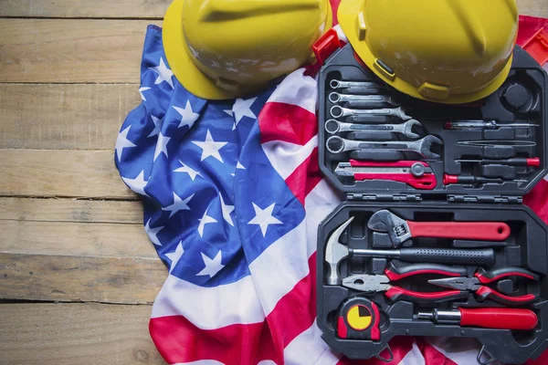 Toolbox with helmets over an American flag — Stock Photo, Image