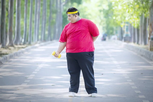 Smiling fat man wears sportswear at autumn — Stock Photo, Image