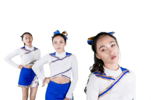 Cheerleading team standing together in the studio — Stock Photo, Image