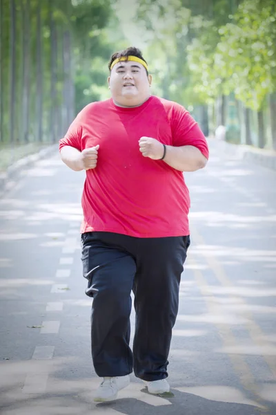 Smiling fat man wears sportswear at autumn — Stock Photo, Image