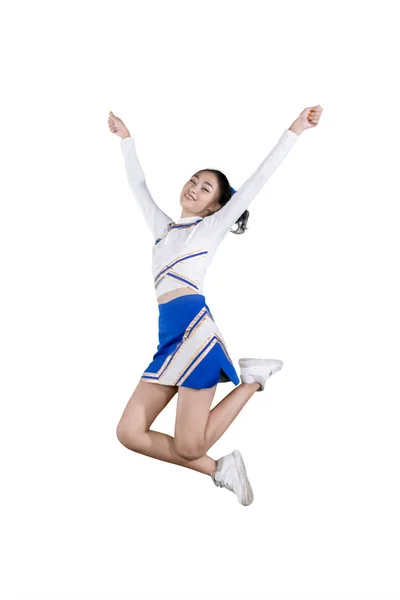 Mooie cheerleader glimlacht en springt op de Studio — Stockfoto