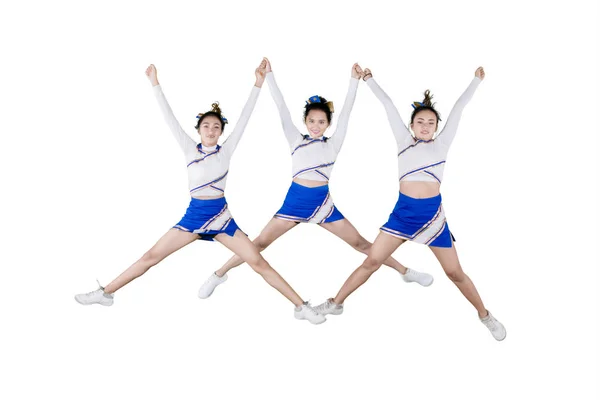 Dość cheerleaderka zespół skoki razem na Studio — Zdjęcie stockowe