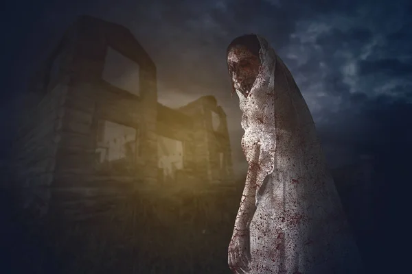 Bride ghost standing near the abandoned house — Stock Photo, Image