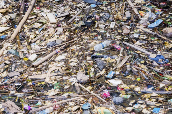 Polluted river with floating variety rubbish — Stock Photo, Image