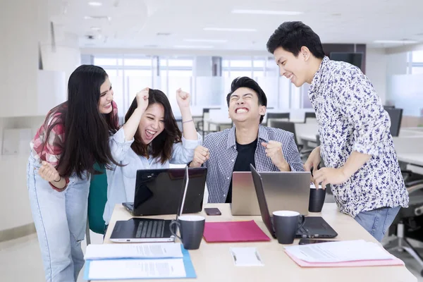 Business team clenched fist to celebrating success — Stock Photo, Image