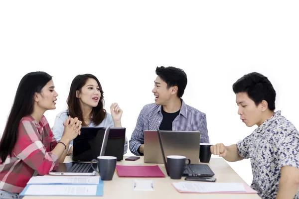 Group of young employees brainstorming on studio — Stock Photo, Image